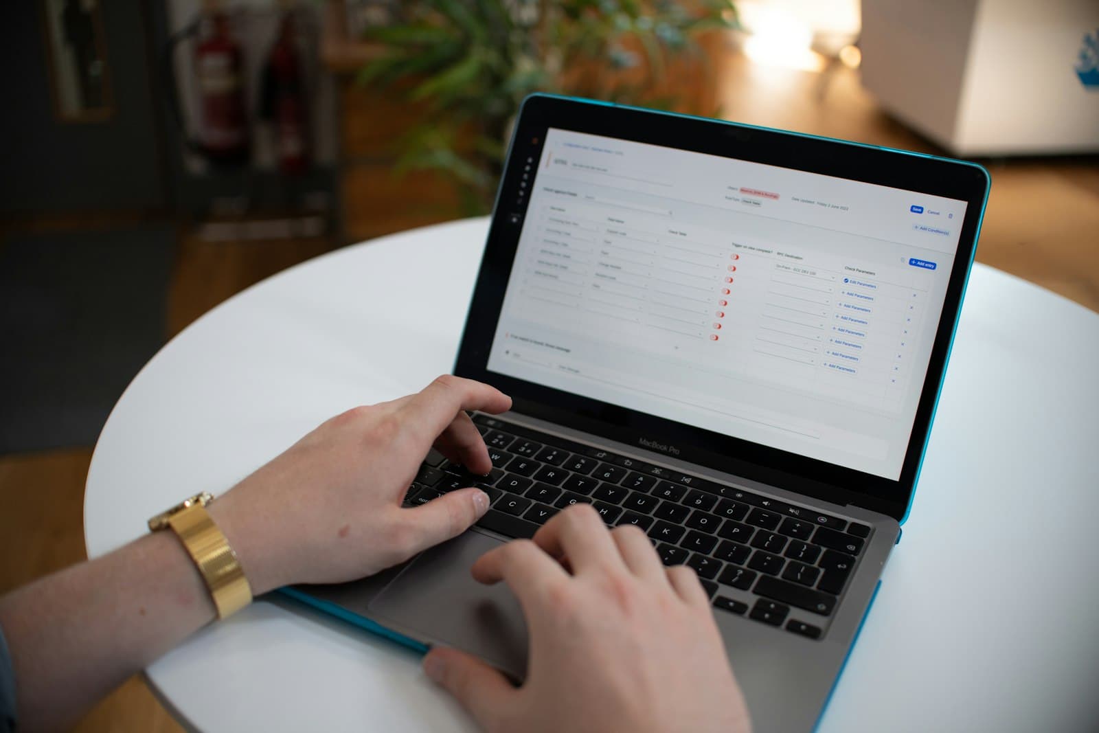 Hands using a laptop spreadsheet representing AI-assisted ERP workflows