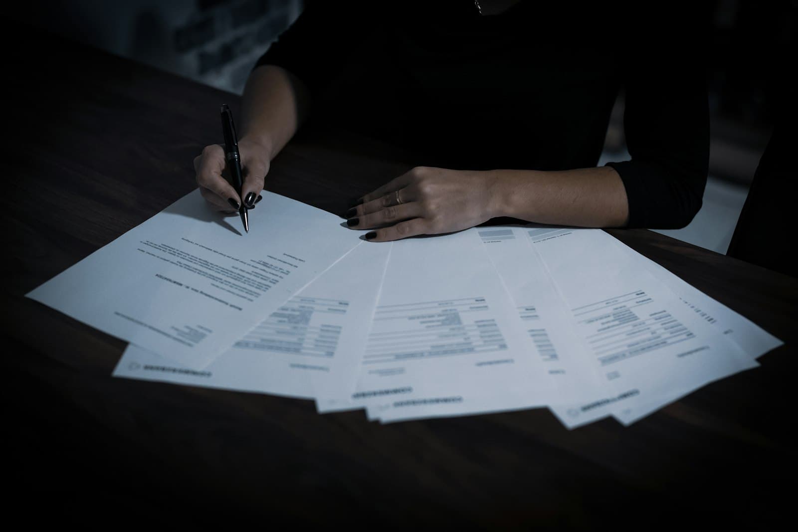 Business finance documents and laptop for ERP software cost planning