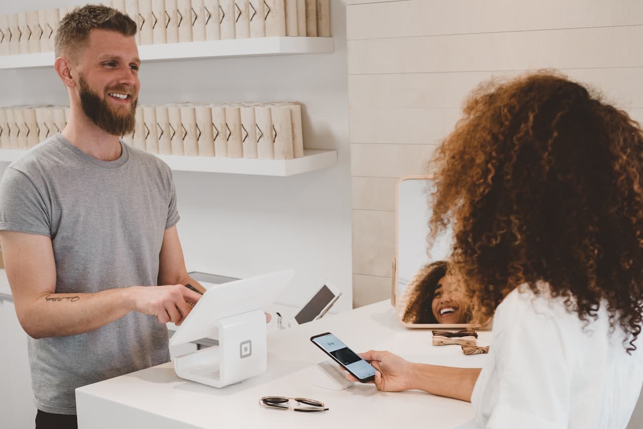 Retail customer making a digital payment at a point of sale